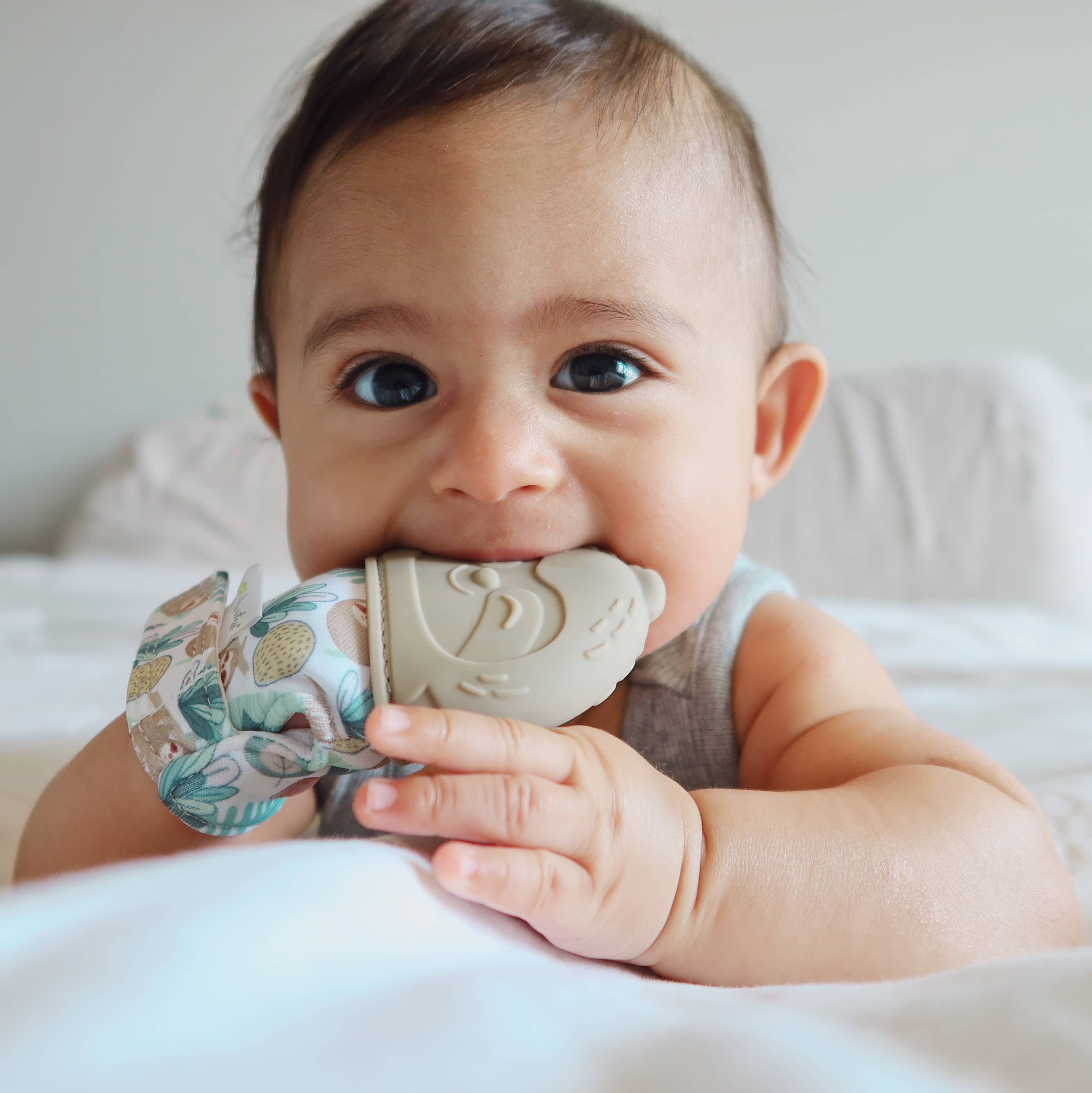 Itzy Mitt™ Silicone Teething Mitts: Dinosaur