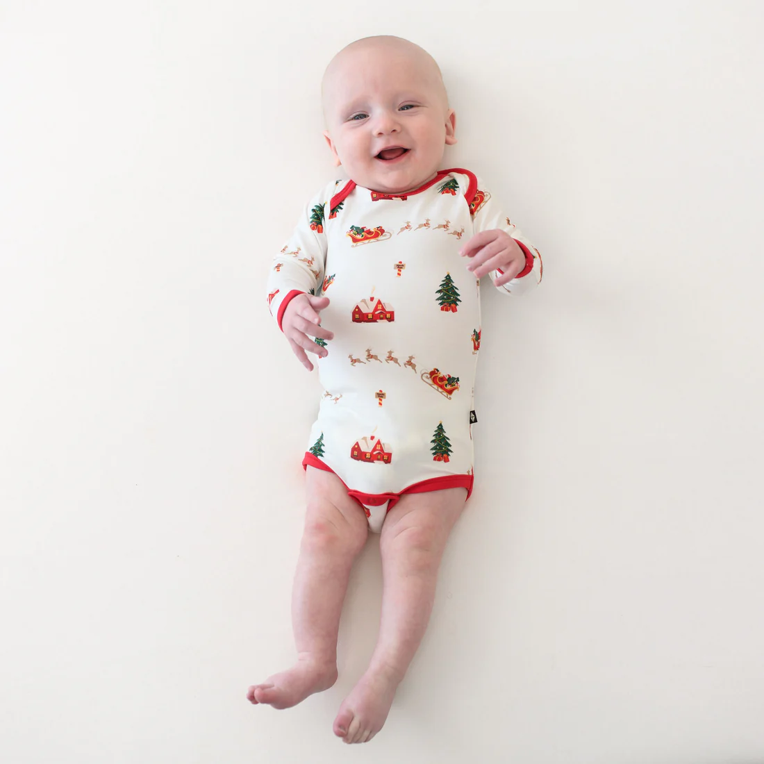 Kyte Baby Long Sleeve Bodysuit in Santa Sleigh - Persnickety Shop