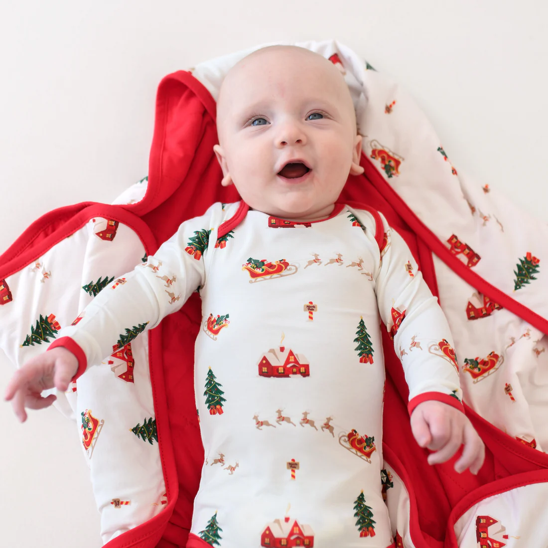 Kyte Baby Long Sleeve Bodysuit in Santa Sleigh - Persnickety Shop